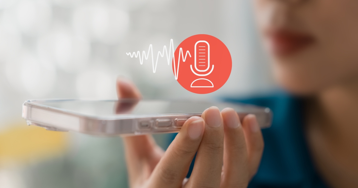 A person holding a smartphone near their mouth. A red microphone icon with an audio wave is above the phone, representing call recording or monitoring.