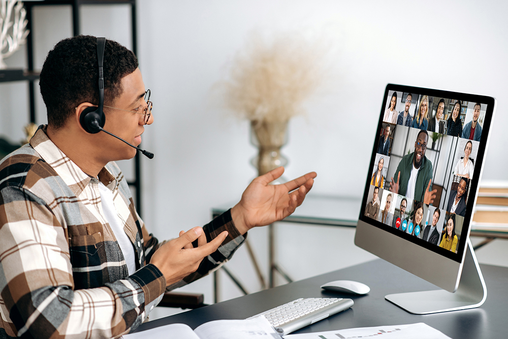 Manager of an outbound sales call center leading a virtual training session on TCPA compliance.