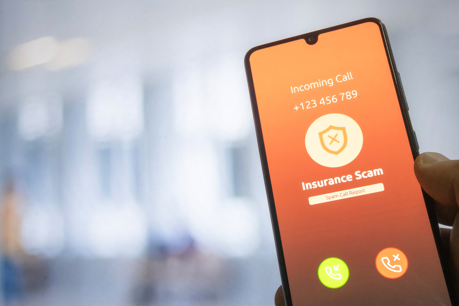 Incoming call screen with a disclaimer that the call is coming from a spoofed phone number related to an insurance scam.